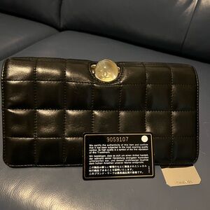 Chanel clutch , leather ,black exterior , white interior.
